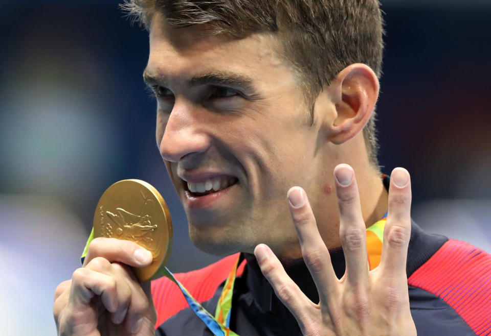 Estados Unidos, uno de los grandes dominadores del medallero los últimos 20 años, da a sus ganadores de oro apenas 25 mil dólares. / En la imagen, Michael Phelps, multimedallista en natación.