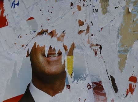 A scratched election campaign poster of former far-right Freedom Party candidate (FPOe) Norbert Hofer is seen in Vienna, Austria, May 24, 2016. REUTERS/Leonhard Foeger