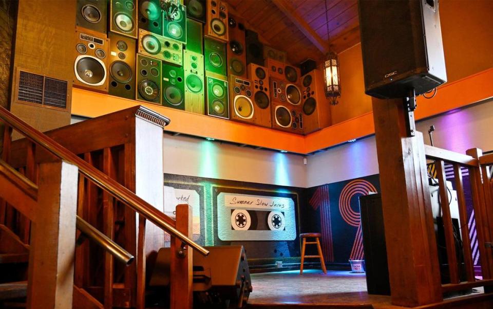 The Backyard Social Club’s stage features a wall of old speakers adding to the eclectic design inside. Photographed Monday, July 3, 2023 in Clovis.