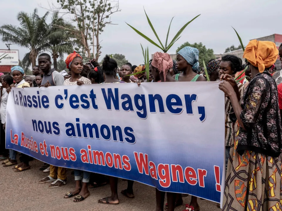 Demonstrators in the Central African Republic carry a banner in support of Russia&#x002019;s Wagner group.