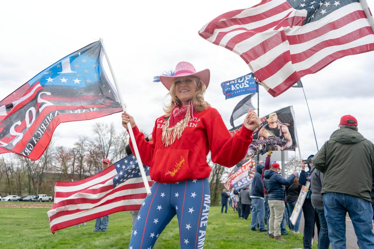 Audrey Strein, center, from Jamison, poses for a photo during a street rally for former President Donald J. Trump across from the Newtown Athletic Center in Newtown on Saturday, April 13, 2024.