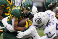 Baylor wide receiver Monaray Baldwin (80) is wrapped up by TCU linebacker Shadrach Banks (19) during the first half of an NCAA college football game in Waco, Texas, Saturday, Nov. 19, 2022. (AP Photo/LM Otero)