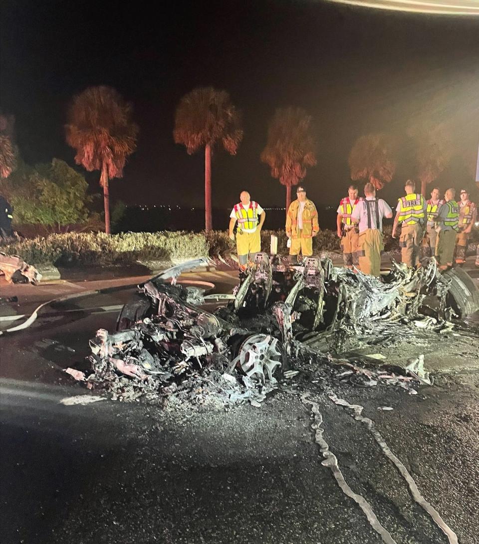 The remains of a Lamborghini sits on Business U.S. 41 in North Fort Myers. The luxury sports car burst into flames after it was involved in a crash with another car Sunday morning. The other car involved was a Mercedes Benz. The Florida Highway Patrol said the two cars had been traveling at a high rate of speed when the crash happened.