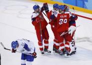 Ice Hockey – Pyeongchang 2018 Winter Olympics – Men Preliminary Round Match – Czech Republic v South Korea - Gangneung Hockey Centre, Gangneung, South Korea – February 15, 2018 - Players from the Czech Republic celebrate after the game as Mike Testwuide of South Korea skates by. REUTERS/Brian Snyder