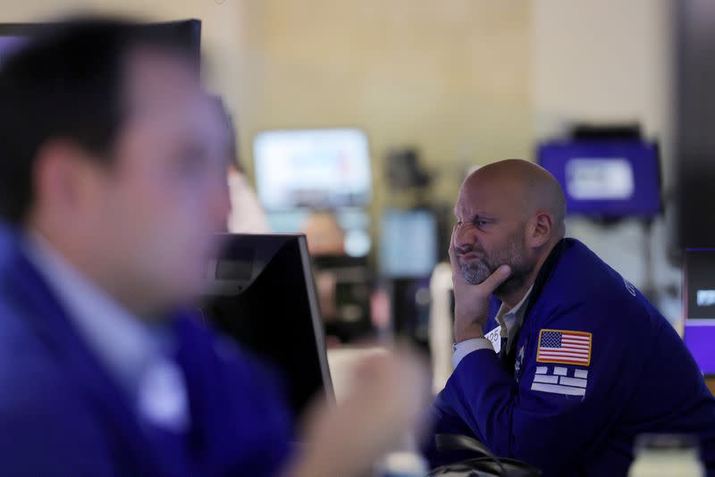 Traders work on the trading floor at the New York Stock Exchange (NYSE) in Manhattan, New York City