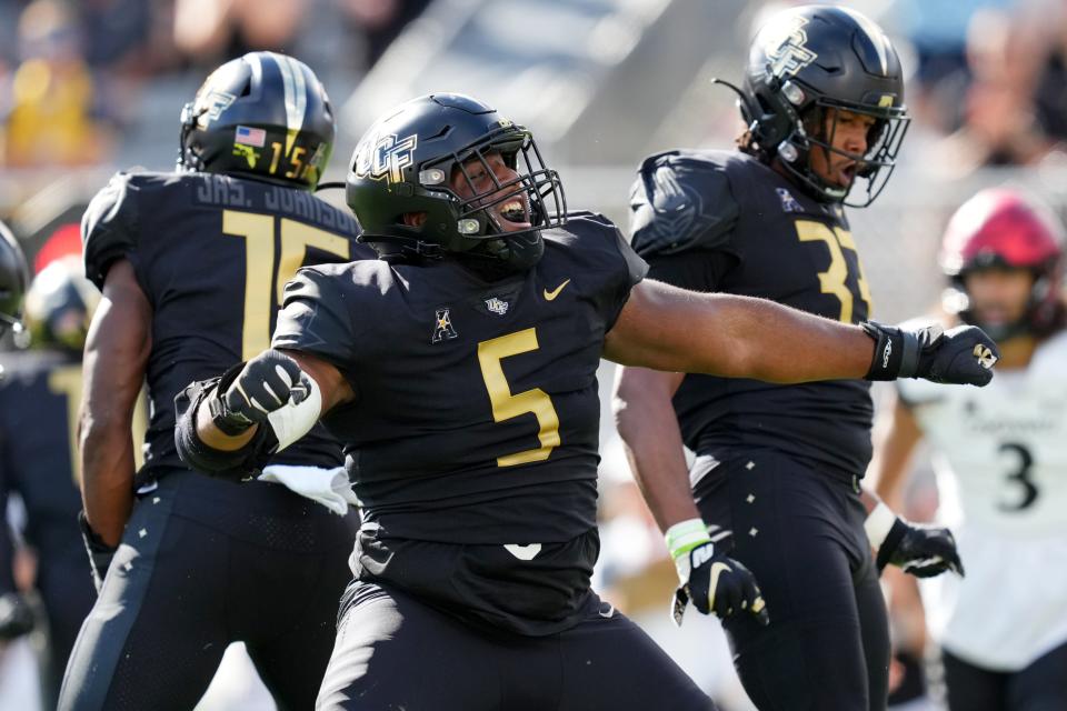 UCF defensive tackle Ricky Barber (5) reacts after a tackle for loss against Cincinnati, Saturday, Oct. 29, 2022, at FBC Mortgage Stadium.