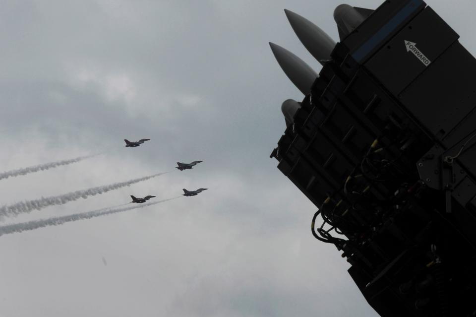 SPYDER, Rafael Advanced Defense Systems' surface-to-air missile system, is on display as F-16 fighter jets of the Singapore Air Force aerobatics team Black Knights perform on the fourth day of the Singapore Airshow in Singapore Friday, Feb. 14, 2014.