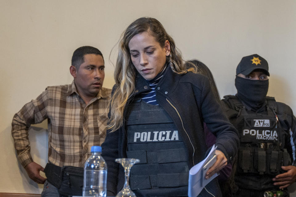 Wearing a bullet proof vest, Andrea Gonzalez, the running mate of slain presidential candidate Fernando Villavicencio, arrives for a press conference in Quito, Ecuador, Thursday, Aug. 10, 2023. Villavicencio was shot and killed as he was leaving a campaign rally at a school in the Ecuadorian capital Wednesday, less than two weeks before the Aug. 20 presidential election. (AP Photo/Carlos Noriega)