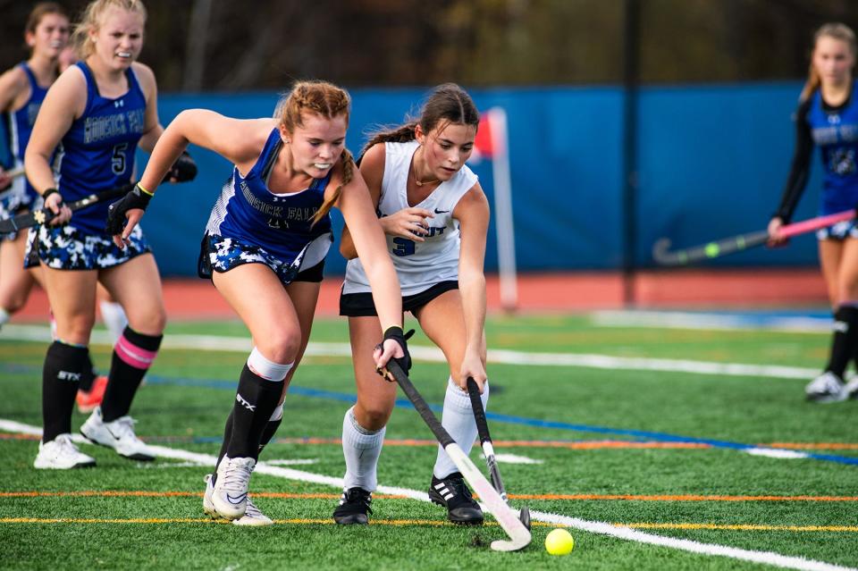 Hoosick Falls' Ava Kasulinous, left, and Rondout's Samantha Schneller battle for the ball during the girls Class C regional field hockey game in Accord, NY on Sunday, November 5, 2023. Rondout lost to Hoosick Falls in overtime 2-1. KELLY MARSH/FOR THE TIMES HERALD-RECORD