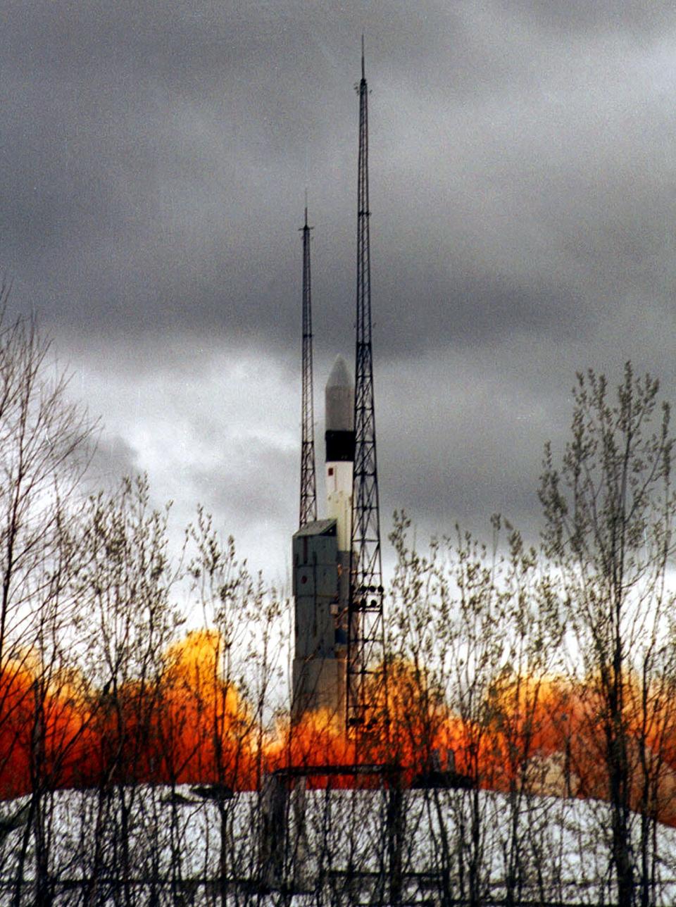 rocket spews orange flame lifts off in the arctic