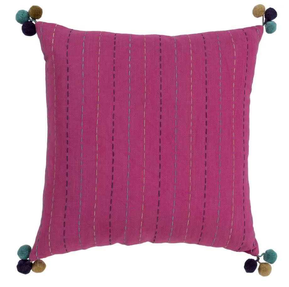 This 18 x 18 square pillow features colorful embroidering and pom-pom tassels. <strong><a href="https://fave.co/2Zoea4H" target="_blank" rel="noopener noreferrer">Find it for $33 at Joss &amp; Main</a>.</strong>