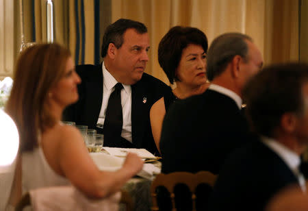 New Jersey Governor Chris Christie watches as U.S. President Donald Trump speaks during the Governor's Dinner in the State Dining Room at the White House in Washington, U.S., February 26, 2017. REUTERS/Joshua Roberts