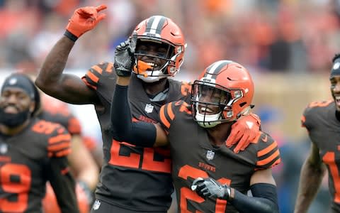 Cleveland Browns defensive back Jabrill Peppers (22) celebrates with defensive back Denzel Ward (21) after Ward blocked a field goal-attempt during the first half of an NFL football game against the Baltimore Ravens - Credit: (AP Photo/David Richard)