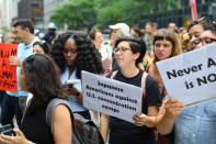 <p>Protesters carrying signs cross E. 42nd Street and head towards the United Nations in New York City on June 20, 2018. (Photo: Gordon Donovan/Yahoo News) </p>