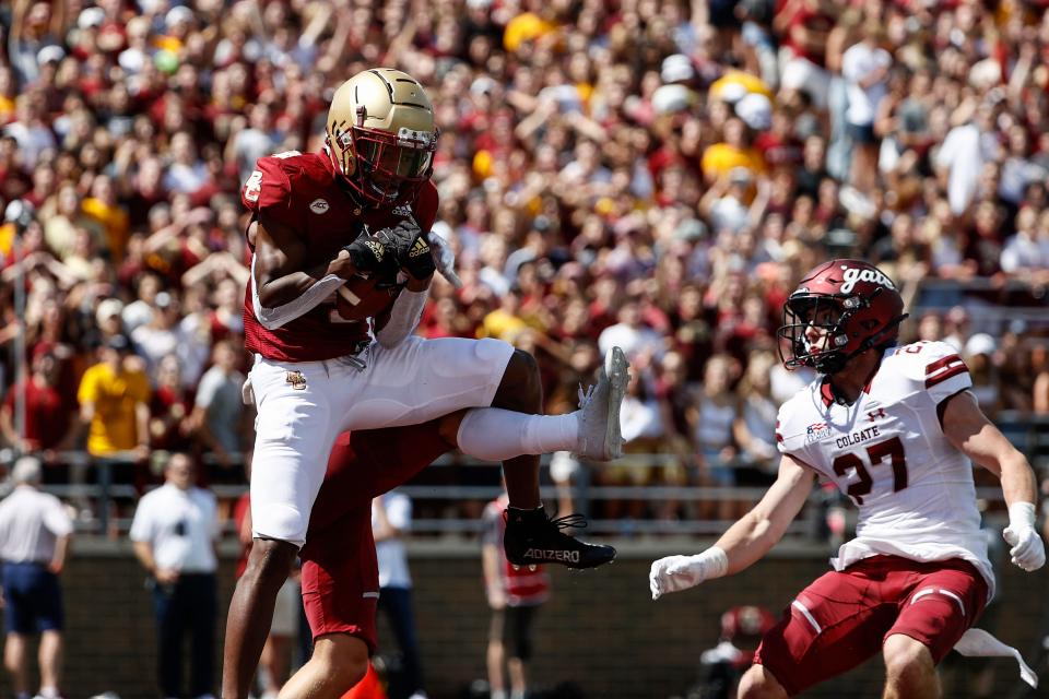 Sep 4, 2021; Chestnut Hill, Massachusetts, USA; Boston College Eagles wide receiver Zay Flowers (4) hauls in a touchdown catch behind Colgate Raiders defensive back Owen Goss (27) during the first half at Alumni Stadium. Mandatory Credit: Winslow Townson-USA TODAY Sports