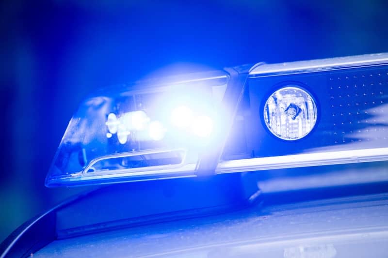 A blue light shines on a police patrol.  A 20-year-old man was attacked with a knife and seriously injured on a train travelling in Germany's Rhineland on Monday morning. Lino Mirgeler/dpa