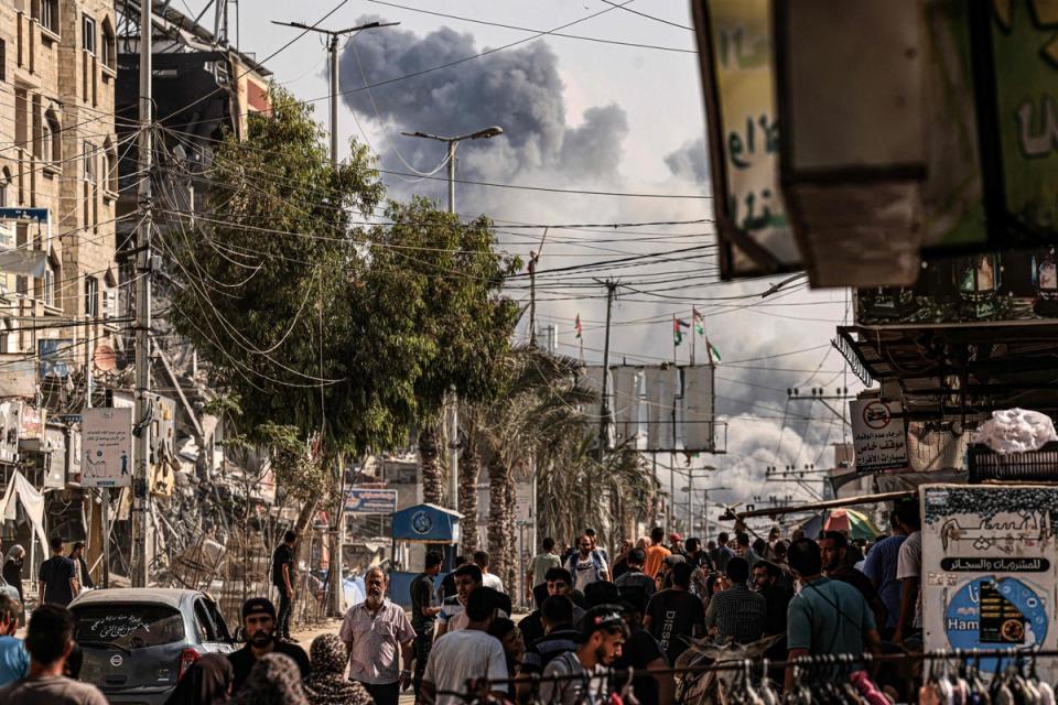 A plume of smoke rises during an Israeli strike on the Bureij refugee camp in the central Gaza Strip (AFP via Getty Images)