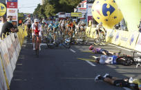 Cyclists are injured in a crash on the final stretch of the opening stage of the Tour de Pologne race in Katowice, Poland, on Wednesday, Aug. 5, 2020. The crash began with a high-speed collision between two Dutchmen sprinting for the win, Fabio Jakobsen and Dylan Groenewegen. Jakobsen was hospitalized in serious condition and put into an induced coma. He was declared the winner of the opening stage and Groenewegen was disqualified after the crash. (AP Photo)