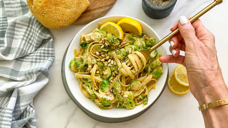 Hand twirling fettuccine pasta