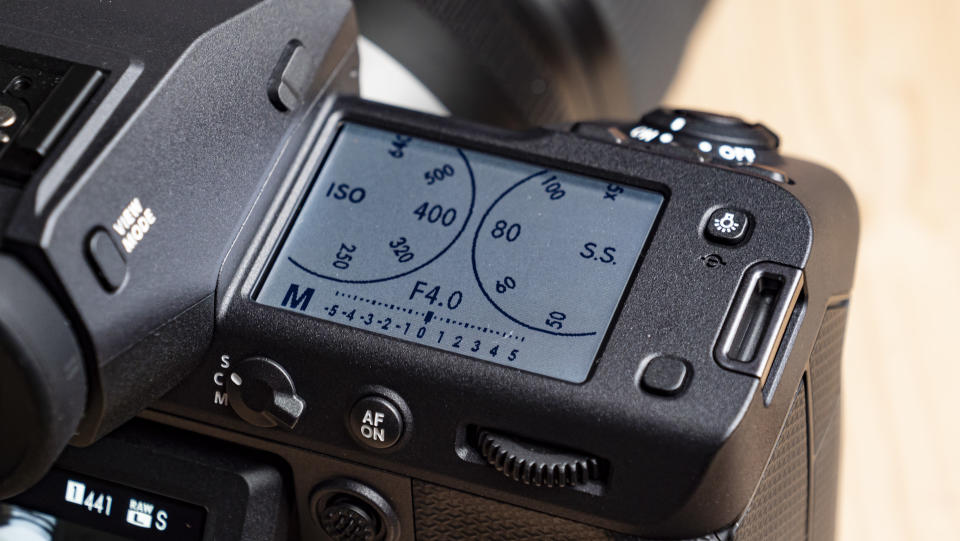 Close up of the Fujifilm GFX100 II 's top LCD displaying exposure dials