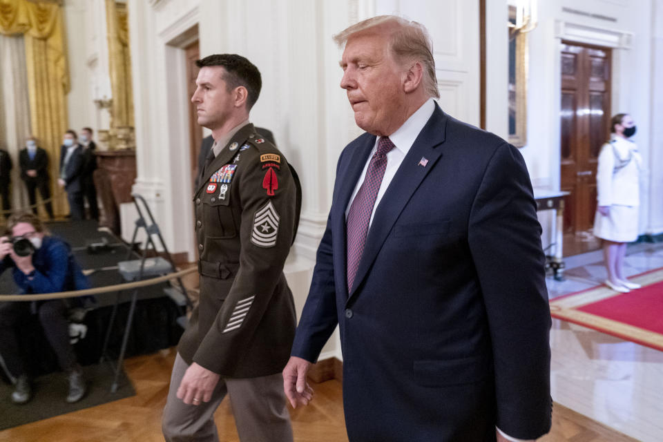 President Donald Trump and Army Sgt. Maj. Thomas P. Payne arrive for a Medal of Honor ceremony in the East Room of the White House, Friday, Sept. 11, 2020, in Washington. (AP Photo/Andrew Harnik)