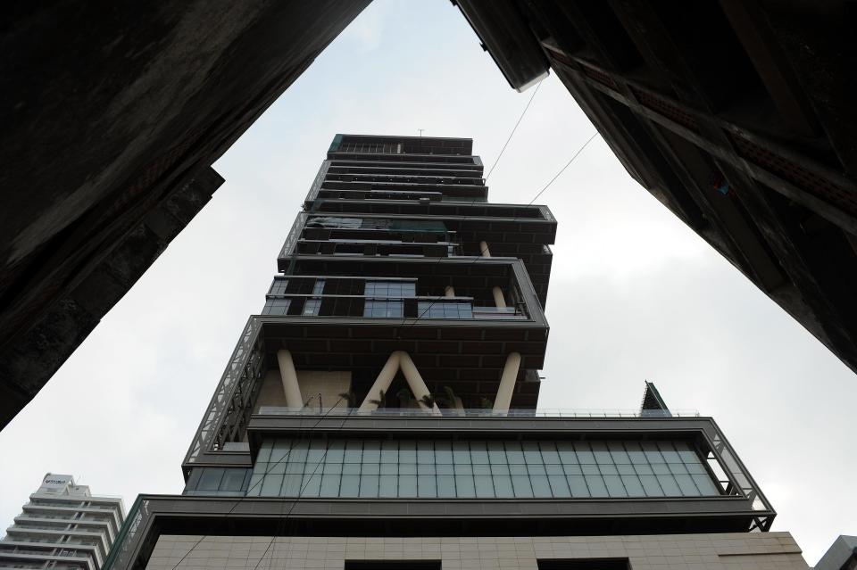 The twenty-seven storey Antilia, the newly-built residence of Reliance Industries chairman Mukesh Ambani, is seen in Mumbai on October 19, 2010. The 400,000 square foot residence, named after a mythical island in the Atlantic, is expected to be occupied by Ambani, his wife and three children later in the year. The building has three helicopter pads, underground parking for 160 cars, and requires some 600 staff to run.