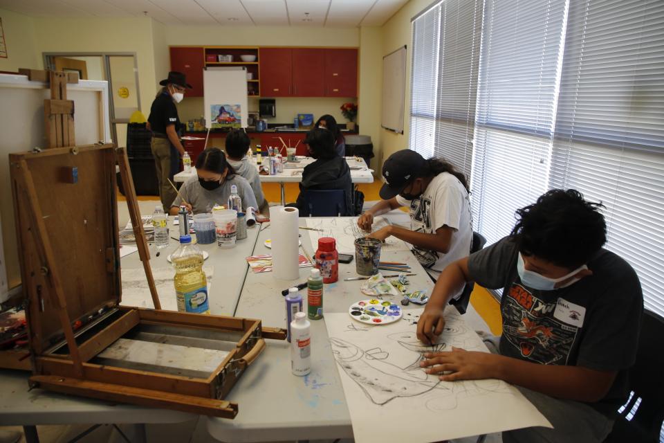 Students work on their paintings at Dahayoigii A Youth Art Event 2022 on July 13 at the Shiprock Youth Complex.