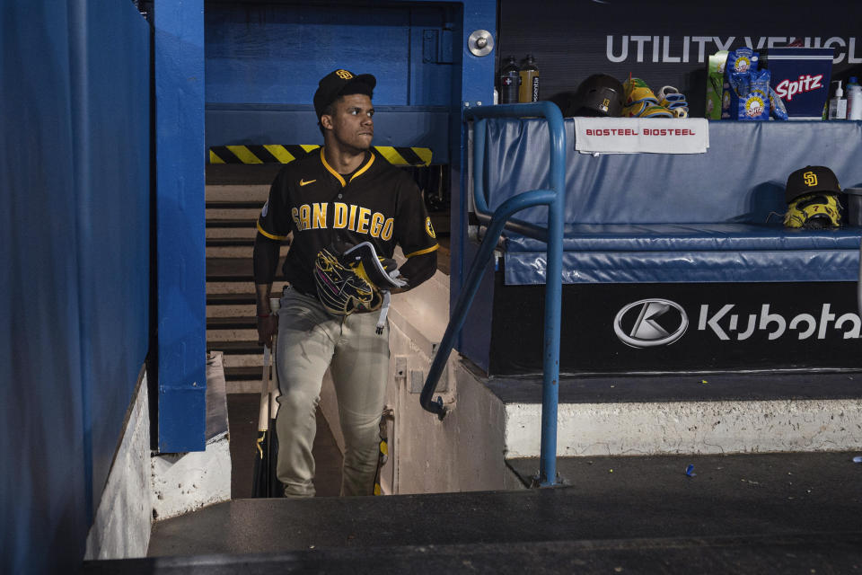 San Diego Padres left fielder Juan Soto steps into the dugout before the team's baseball game against the Toronto Blue Jays on Wednesday, July 19, 2023, in Toronto. (Chris Young/The Canadian Press via AP)