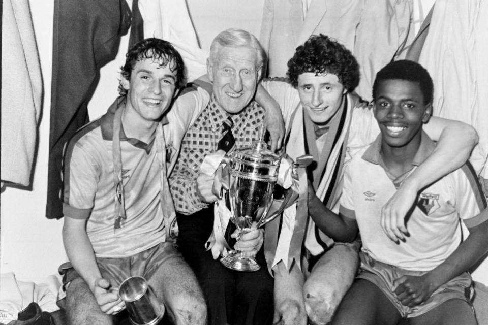 Watford Observer: Watford's legendary training staff stalwart Pat Molloy joins in the celebrations in the dressing room