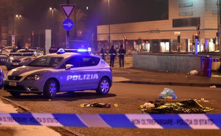 The body of Anis Amri, the suspect in the Berlin Christmas market truck attack, is seen covered by a thermal blanket in a suburb of the northern Italian city of Milan, Italy December 23, 2016. REUTERS/Stringer