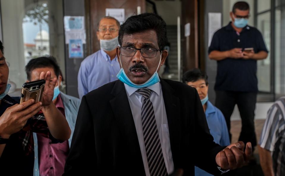 Lawyer K. Kunasekaran, who represented three farmers from Kuala Kuang, Chemor on the land eviction issue, speaks to reporters outside the High Court in Ipoh July 2, 2020. ― Picture by Farhan Najib