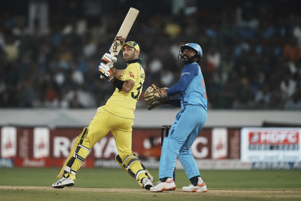 Australia's Glenn Maxwell, left, bats during the third T20 cricket match between India and Australia, in Hyderabad, India, Sunday, Sept. 25, 2022. (AP Photo/Mahesh Kumar A)