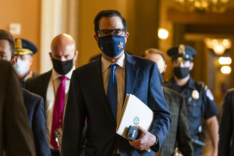 Treasury Secretary Steven Mnuchin, walks from the office of Senate Majority Leader Sen. Mitch McConnell of Ky., as he leaves the Capitol, Wednesday, Sept. 30, 2020, in Washington. Mnuchin earlier met with House Speaker Nancy Pelosi of Calif. (AP Photo/Manuel Balce Ceneta)