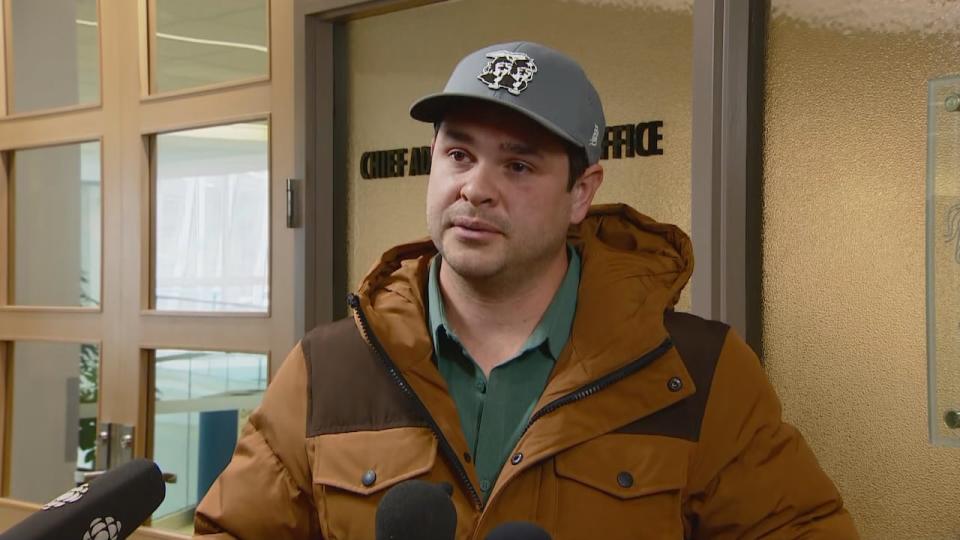 Calgary business owner Landon Johnston speaks to reporters at city hall on Friday following his 15-minute conversation with Mayor Jyoti Gondek.