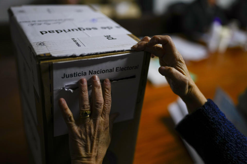 A voter casts her ballot for primary elections in Buenos Aires, Argentina, Sunday, Aug. 13, 2023. (AP Photo/Natacha Pisarenko)