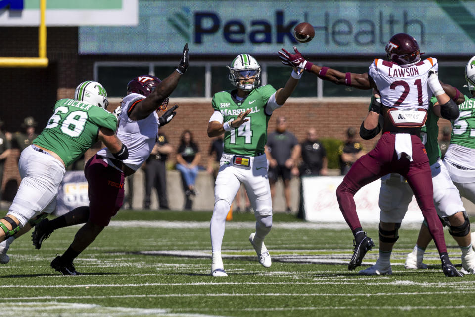 Marshall quarterback Cam Fancher (14) makes a throw as the Herd takes on Virginia Tech during an NCAA college football game, Saturday, Sept. 23, 2023, at Joan C. Edwards Stadium in Huntington, W.Va. (Sholten Singer/The Herald-Dispatch via AP)