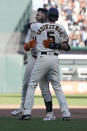 San Francisco Giants' David Villar, left, is congratulated by Mike Yastrzemski after hitting a two-run single during the 10th inning of a baseball game against the Arizona Diamondbacks in San Francisco, Sunday, Oct. 2, 2022. (AP Photo/Jeff Chiu)