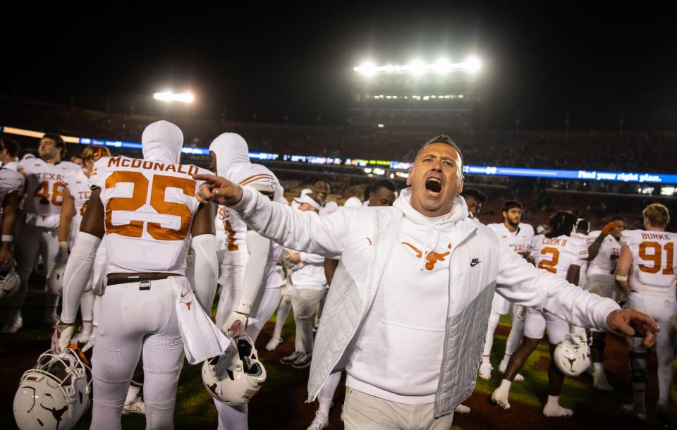 Texas coach Steve Sarkisian celebrates after the Longhorns moved closer to clinching a spot in the Big 12 title game with a 26-16 road win over Iowa State on Saturday. The Horns haven't played in the title game since 2018 and haven't won it since 2009.