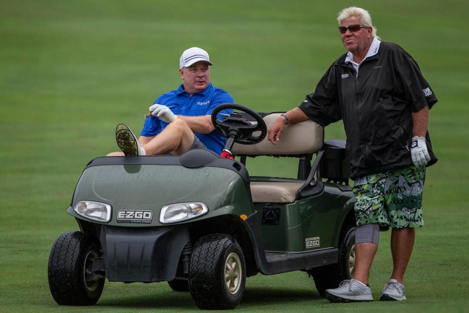 University of Kentucky football coach Mark Stoops, left, chats with golfer John Daly during pro-am day for the PGA Barbasol Championship in 2019. Daly is schedule to play again this year.