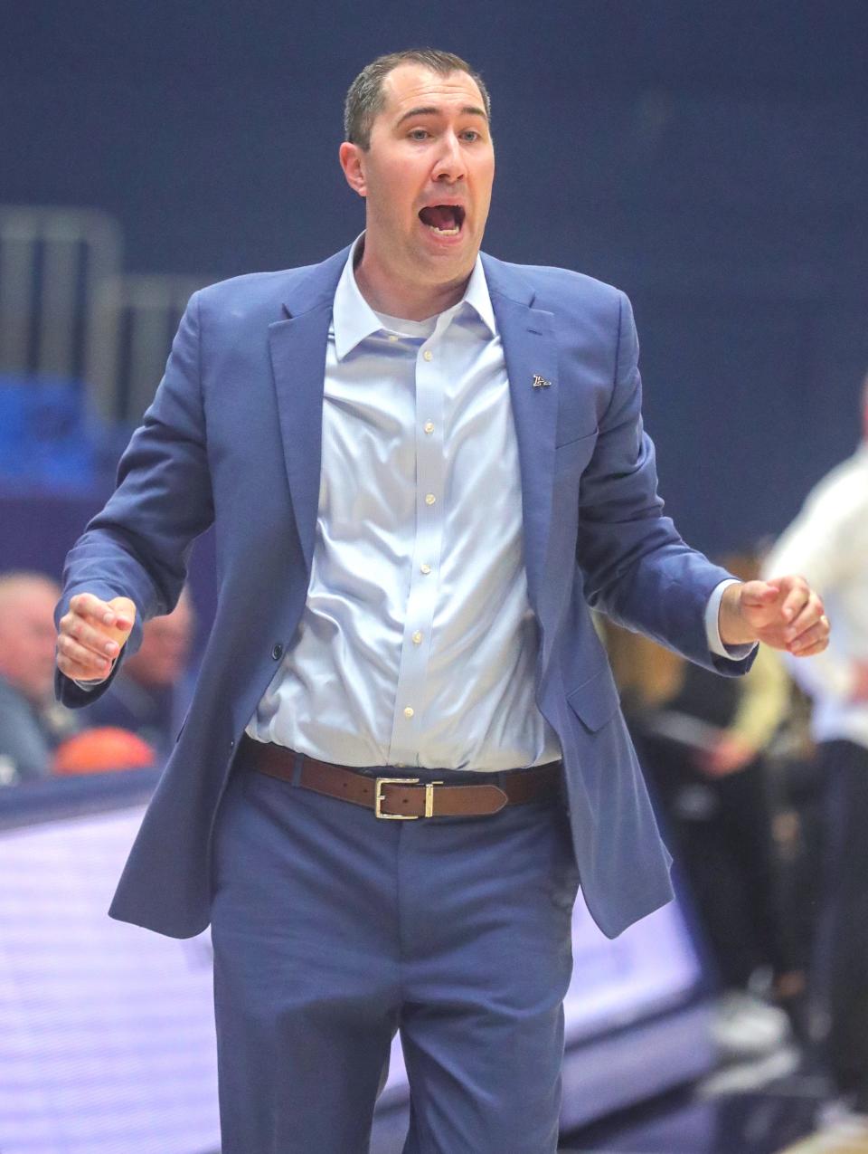 University of Akron coach Ryan Gensler reacts after a hard second-quarter foul on Alexus Mobley in a game against Oakland on Monday in Akron.