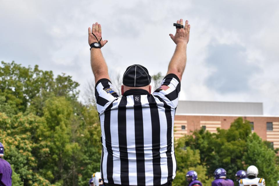 A PIAA referee signals a touchdown during a football scrimmage between East Stroudsburg South and Executive Education Academy in East Stroudsburg on Saturday, Aug. 21, 2021.