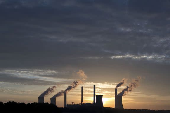 The coal-fired Plant Scherer, one of the nation's top carbon dioxide emitters, stands in the distance in Juliette, Ga., Saturday, June 3, 2017.