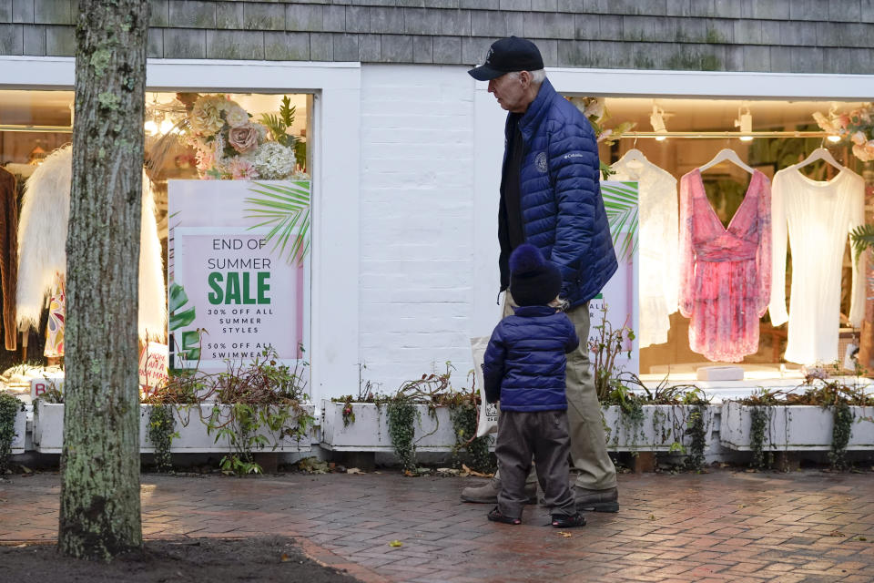 President Joe Biden walks with his grandson Beau Biden in Nantucket, Mass., Friday, Nov. 25, 2022. (AP Photo/Susan Walsh)