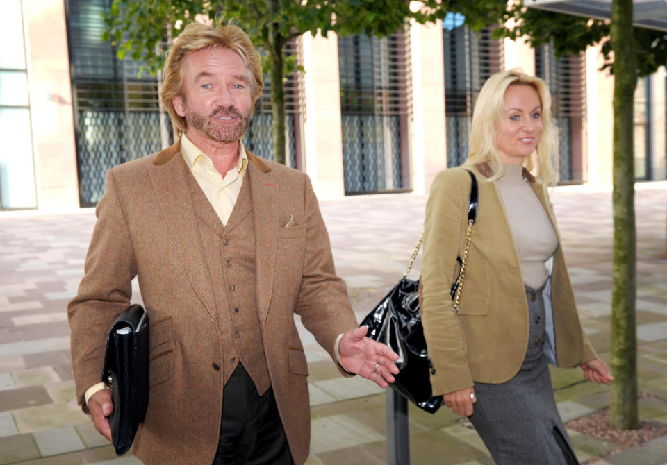 TV presenter Noel Edmonds and his wife Liz Davies, leave Bristol County Court, where Mr Edmonds is in a legal dispute with former business partner Ulrik Lawson.   (Photo by Tim Ireland/PA Images via Getty Images)