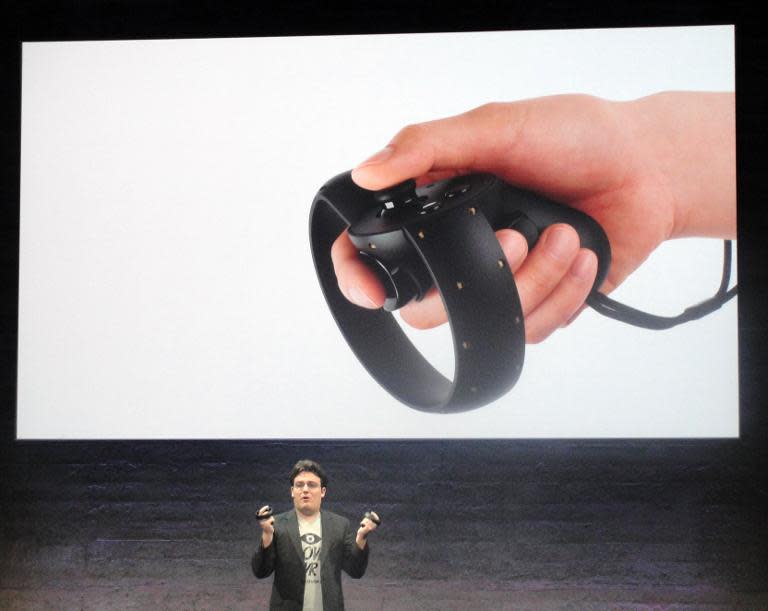 Oculus founder Palmer Luckey reveals a 'Touch' device the virtual reality firm is creating to let people reach into digital worlds and interact with virtual objects, in San Francisco, California, on June 11, 2015
