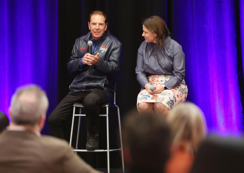 Fraser Bullock and Catherine Raney Norman, who lead the Salt Lake City-Utah Committee for the Olympic Games, speak.