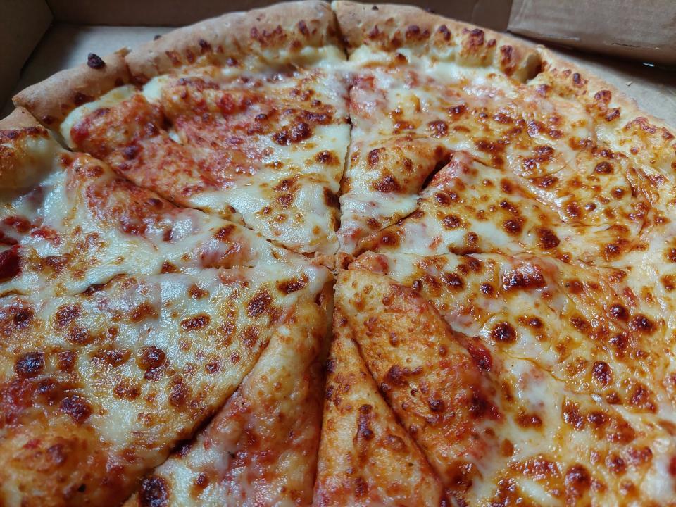 Slices of pizza from Papa John's, displayed in a box