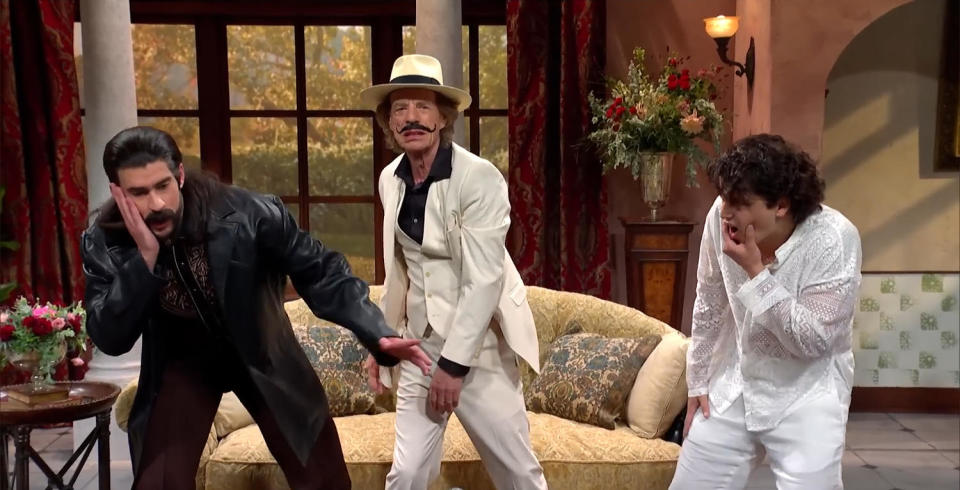 Mick Jagger, Bad Bunny, and Marcello Hernández act out a dramatic father-son scene in a telenovela. (Saturday Night Live)