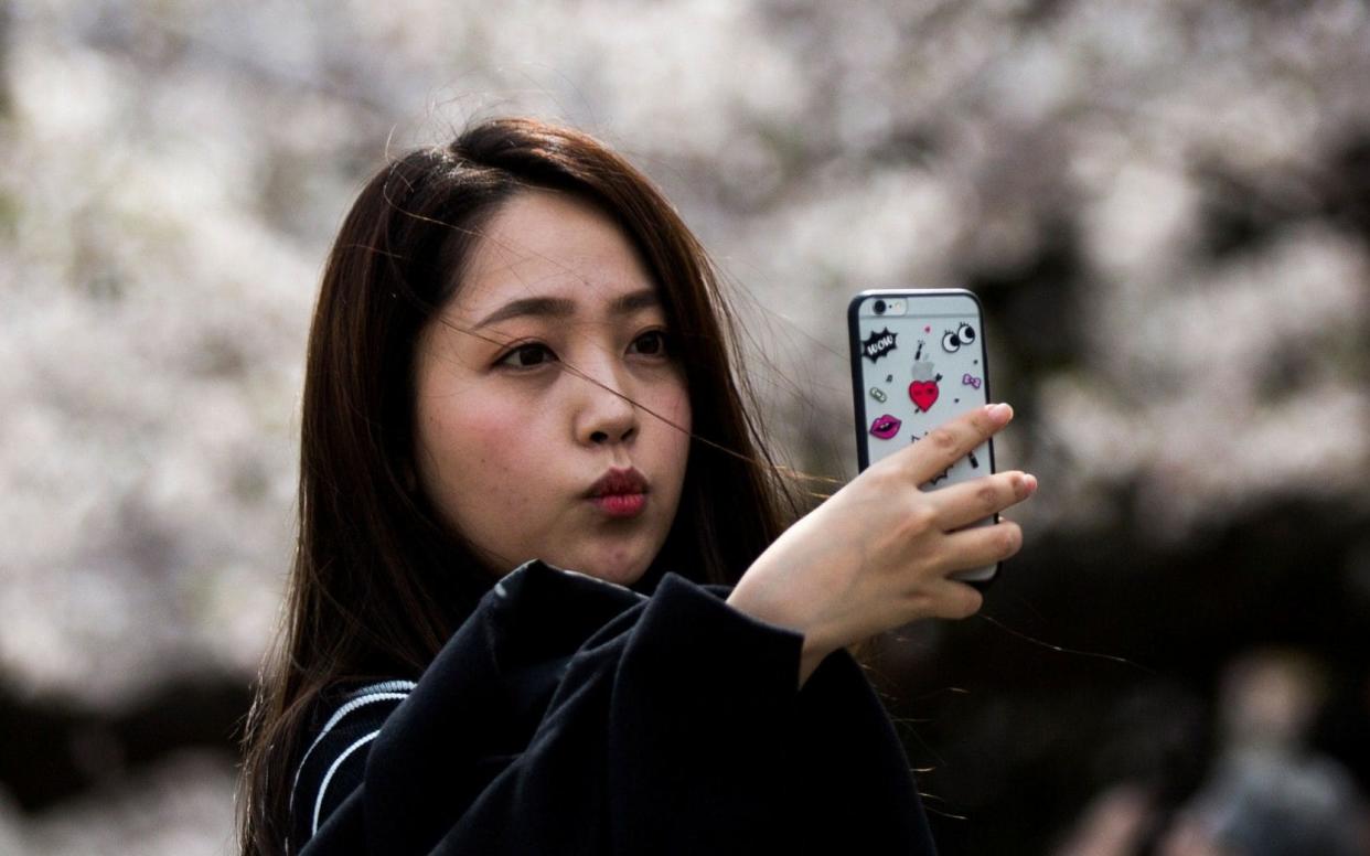 There are concerns among parents in Japan about the excessive use of smartphones - AFP