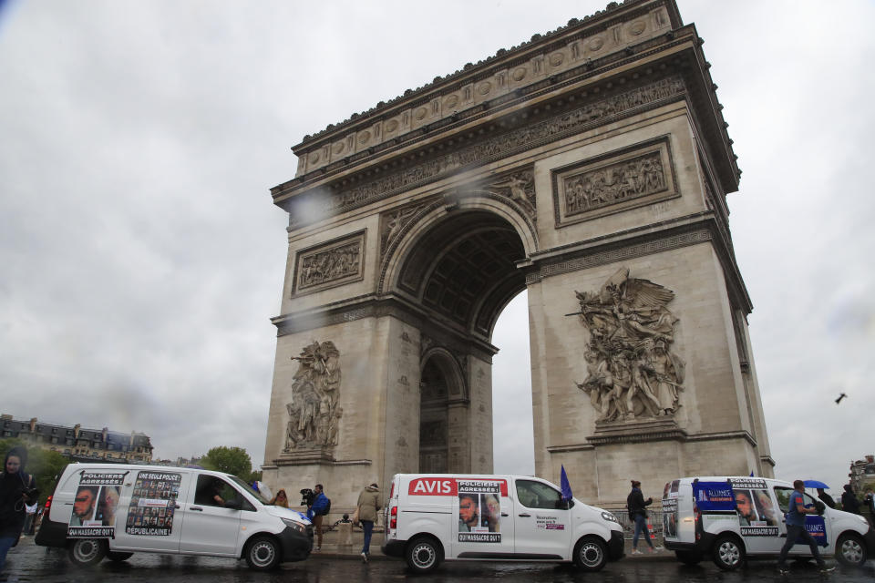 French police unionists demonstrate at the Arc de Triomphe, Friday, June 12, 2020 in Paris. French police are protesting a new ban on chokeholds and limits to what they can do during arrests, part of government efforts to stem police brutality and racism in the wake of global protests over George Floyd's death in the U.S. (AP Photo/Michel Euler)